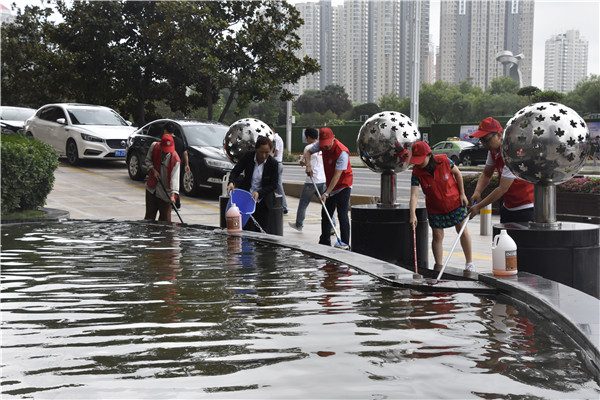 完美官方网站-完美wanmei(中国)联合商务区社区开展“清洁家园 美化社区” 主题志愿服务活动